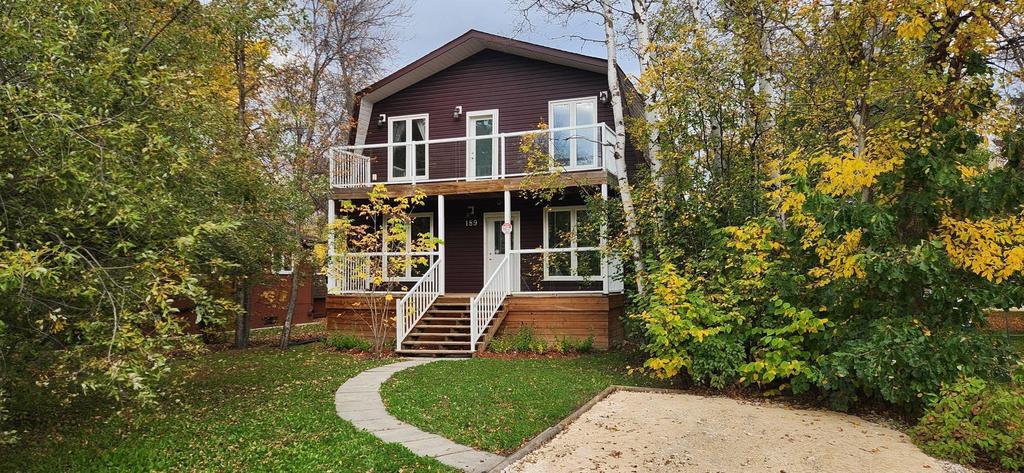 189 6th Street, Gimli &middot; the front of the two-storey home with its covered front deck and balcony