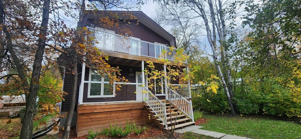 189 6th Street, Gimli &middot; the front deck and upper balcony among the trees