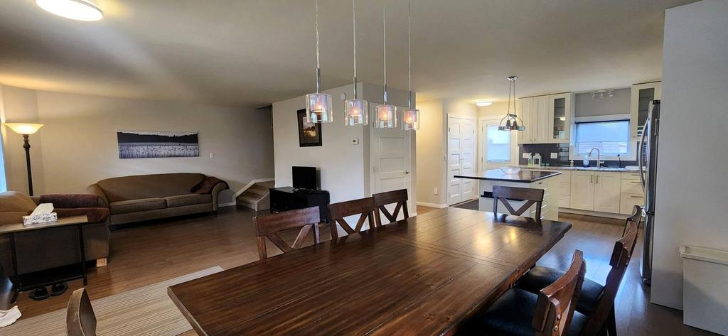 189 6th Street, Gimli &middot; the open main floor from the dining table to the living room