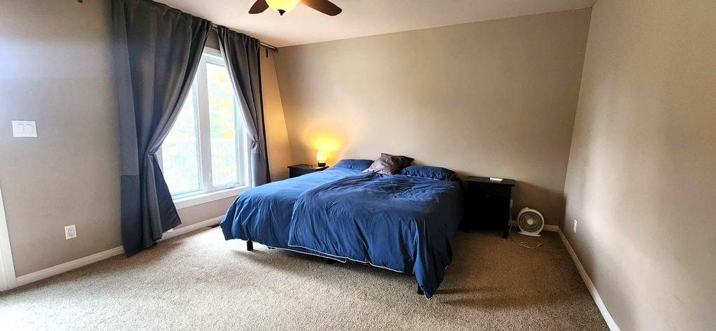 189 6th Street, Gimli &middot; primary bedroom with a ceiling fan