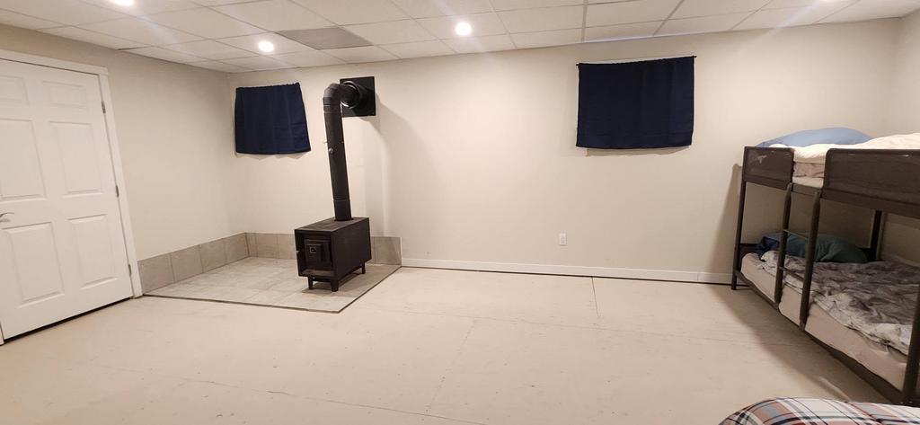 189 6th Street, Gimli &middot; basement rec room with a wood stove