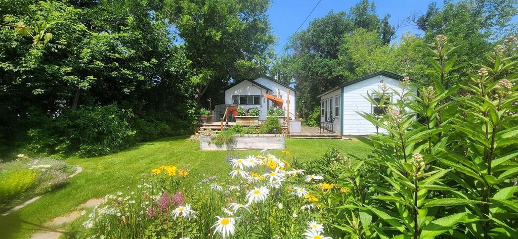 2 Maplewood Avenue, Whytewold · backyard gardens with the cottage and bunkhouse beyond