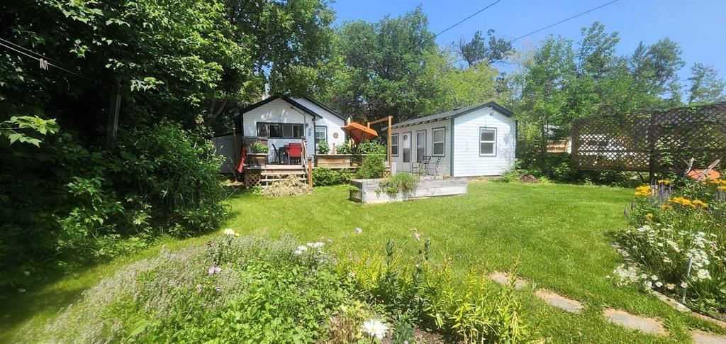 2 Maplewood Avenue, Whytewold · backyard with raised planters, deck, and bunkhouse