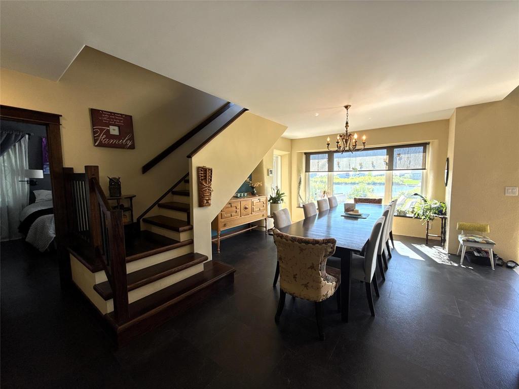20053 Minerva Road &middot; the staircase, with the long dining table by the windows