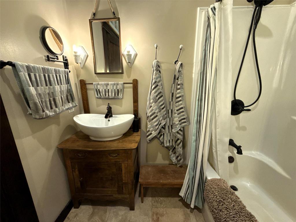 20053 Minerva Road &middot; the main bathroom vanity, a vessel sink on wood