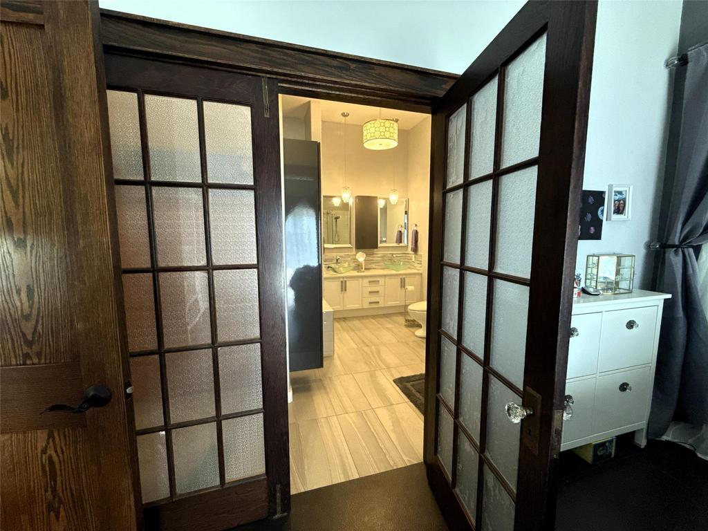 20053 Minerva Road &middot; sliding screen doors opening from the primary bedroom into the ensuite