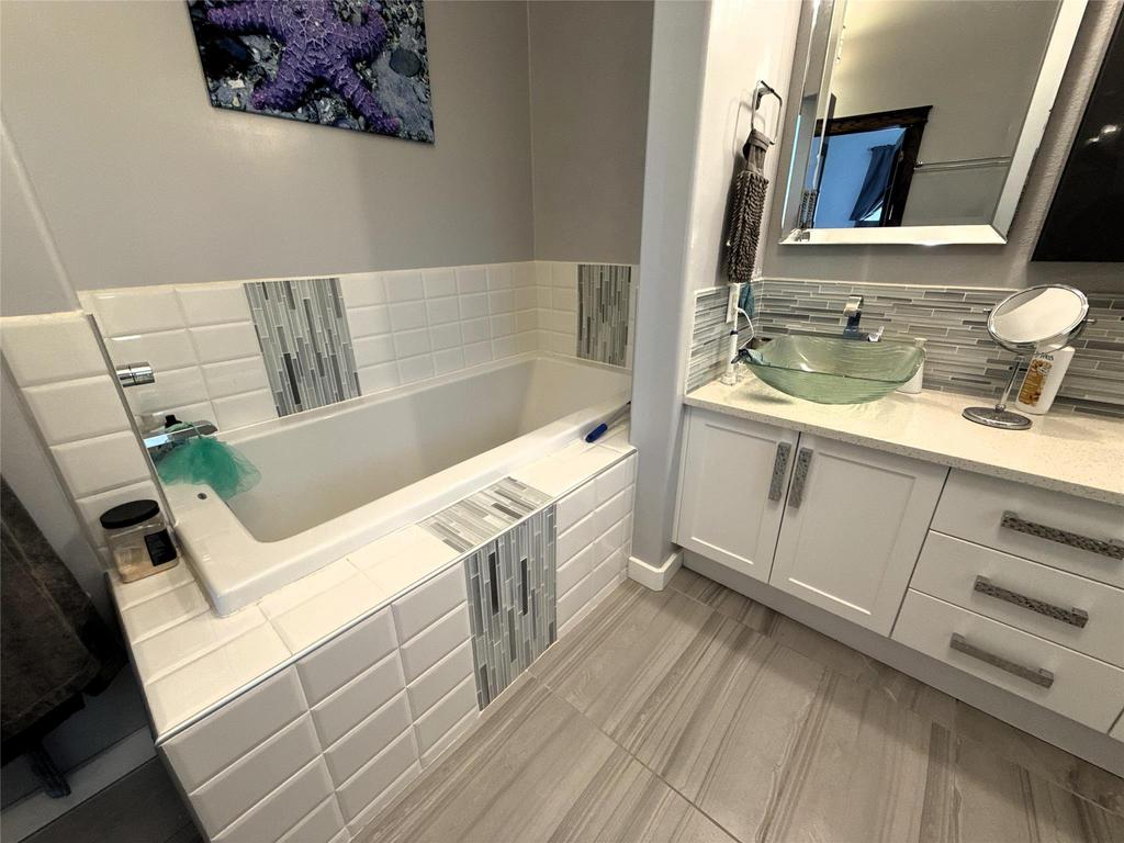 20053 Minerva Road &middot; the soaker tub in the ensuite, beside the vanity