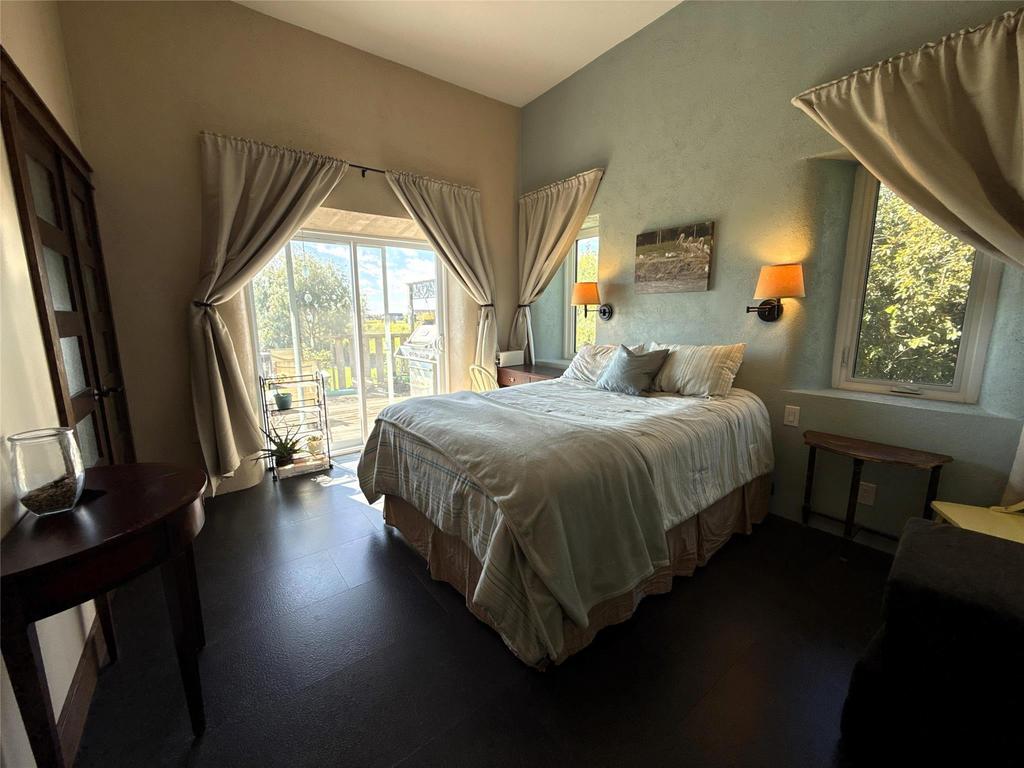 20053 Minerva Road &middot; the second bedroom, with a large window and wall sconces
