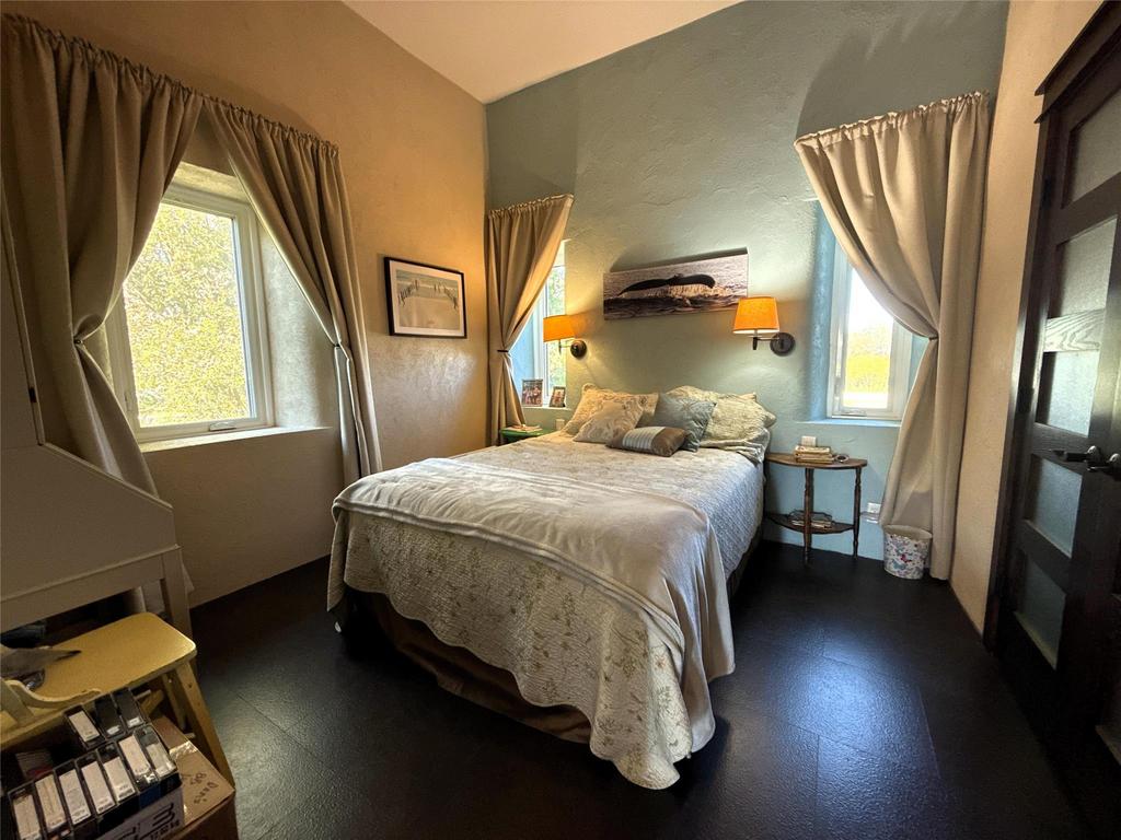 20053 Minerva Road &middot; the third bedroom, with windows on two walls and wall sconces