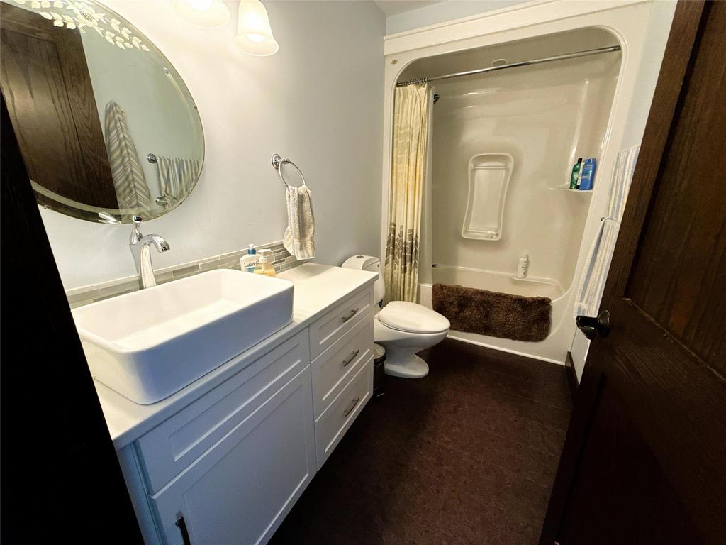 20053 Minerva Road &middot; the upstairs bathroom, with a vanity and a tub and shower