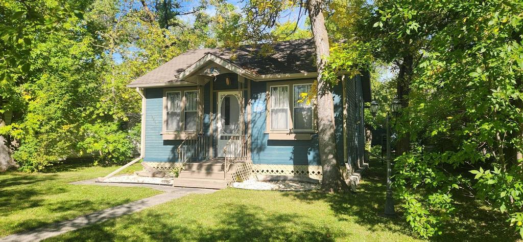 241 Maple Avenue &middot; the cottage from the front yard, under mature trees