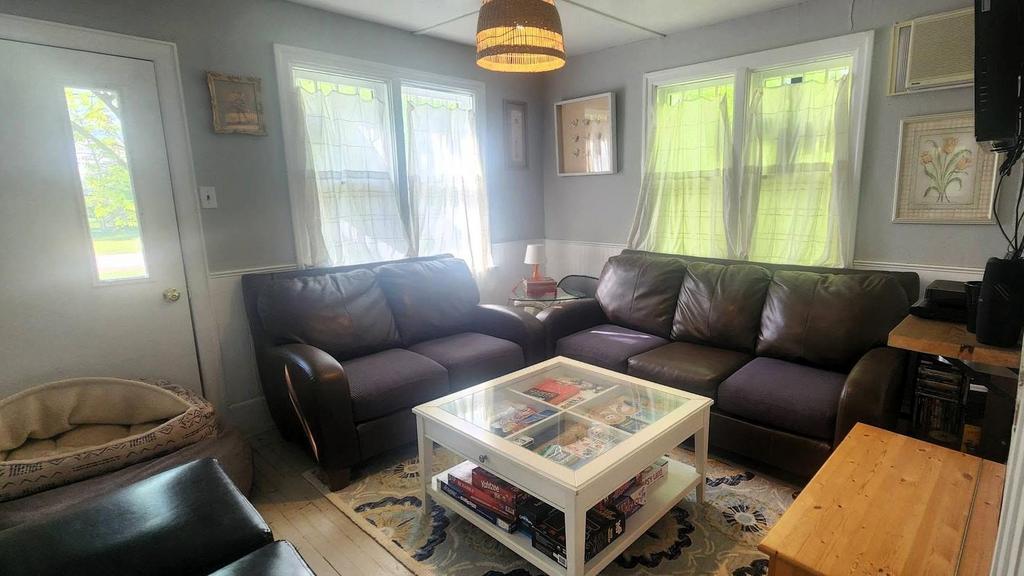 241 Maple Avenue &middot; the living room, with leather seating around a low table