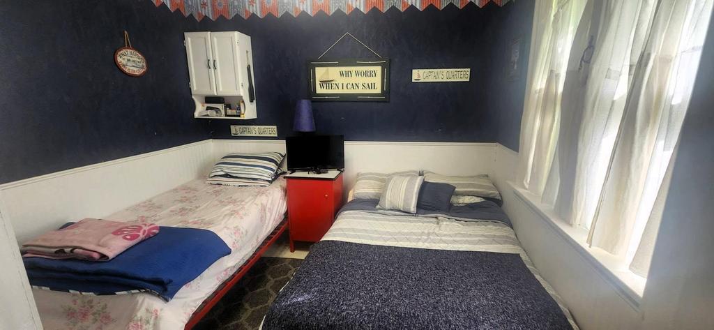 241 Maple Avenue &middot; the first bedroom, with two beds against the dark wall