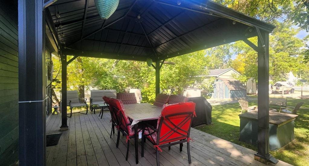 241 Maple Avenue &middot; the covered back deck, set up with a dining table