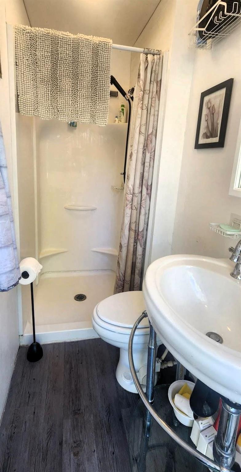 241 Maple Avenue &middot; inside the three-piece bathroom, with a shower, toilet and sink