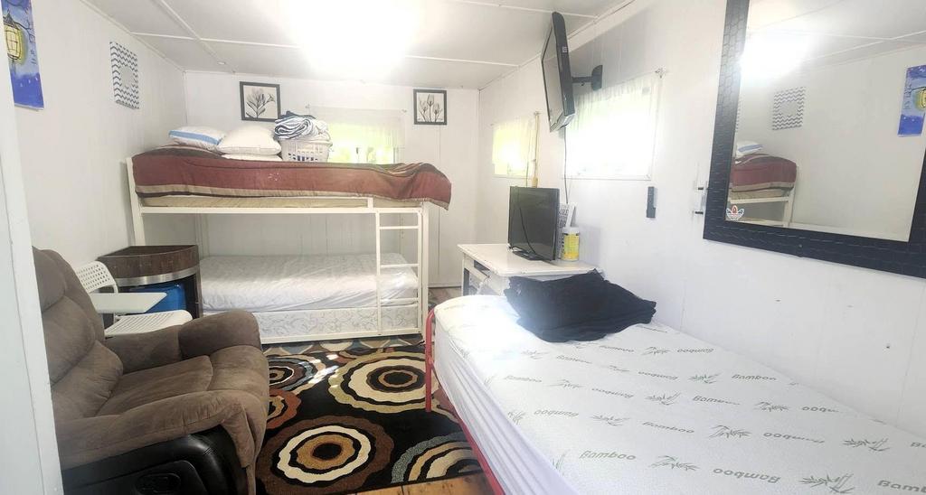 241 Maple Avenue &middot; inside the guest house, with bunk beds and seating