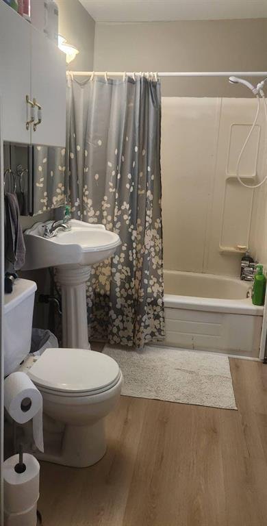 310 Epsilon Avenue, Winnipeg Beach &middot; Bathroom with a tub and shower, pedestal sink and toilet
