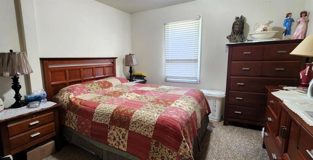 310 Epsilon Avenue, Winnipeg Beach &middot; Bedroom with a double bed, dresser and window