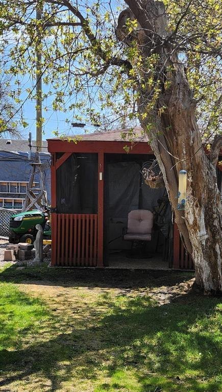 310 Epsilon Avenue, Winnipeg Beach &middot; Screened gazebo shaded by a mature tree in the back yard