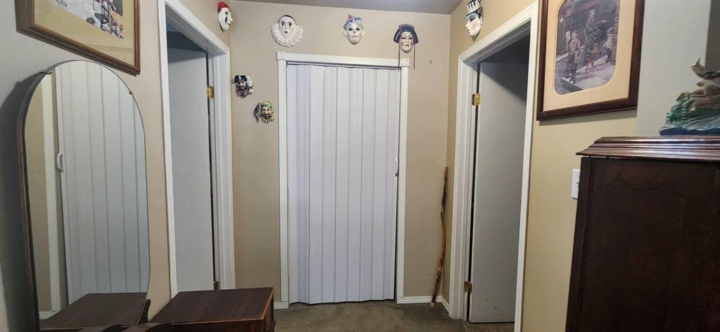 310 Epsilon Avenue, Winnipeg Beach &middot; Hallway with closets and doors through to the bedrooms