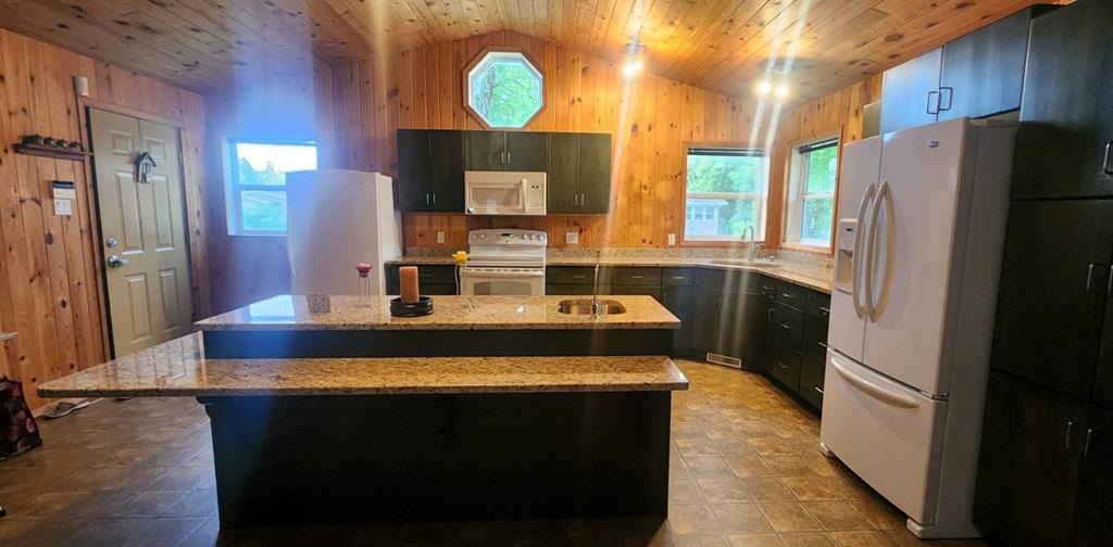 325 Epsilon Avenue, Winnipeg Beach &middot; kitchen from the other side, showing the island and refrigerator