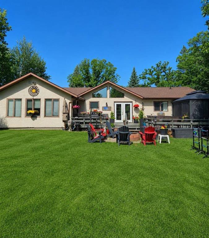 34 Nicklaus Drive, Sandy Hook · back of the home from the yard, deck, gazebo and seating