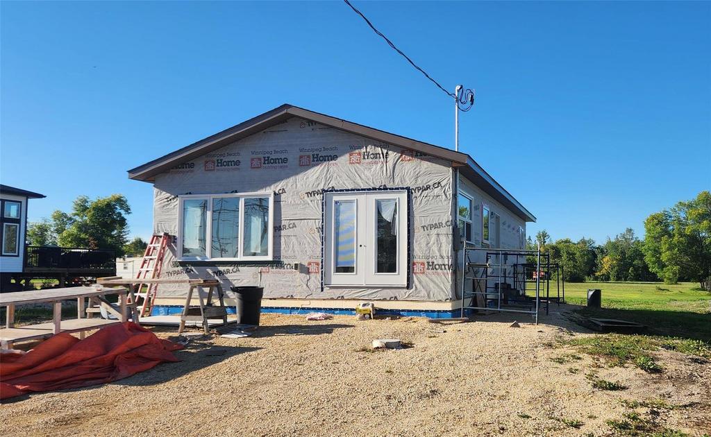 349 Kernstead Road &middot; the new build from the front, framed and wrapped with the windows in