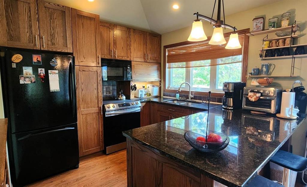 35 Thorvaldson Drive, Arnes · kitchen with granite countertops, upper level