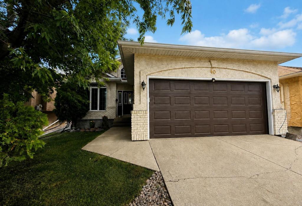 40 Forestgate Avenue, Linden Woods · front of the bungalow with its double attached garage and mature trees
