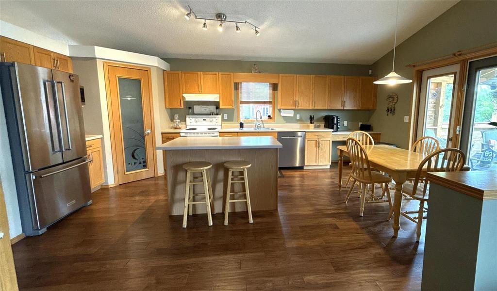 40 Forestgate Avenue, Linden Woods · kitchen with an island, stainless appliances and the dining area beyond