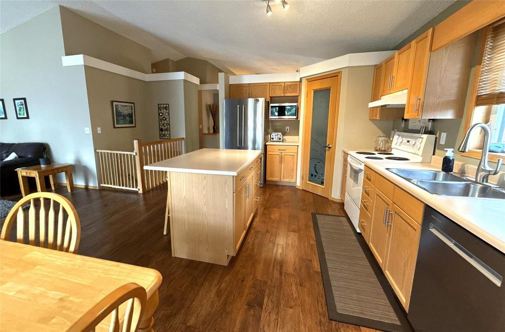 40 Forestgate Avenue, Linden Woods · kitchen island and dining table looking toward the entry