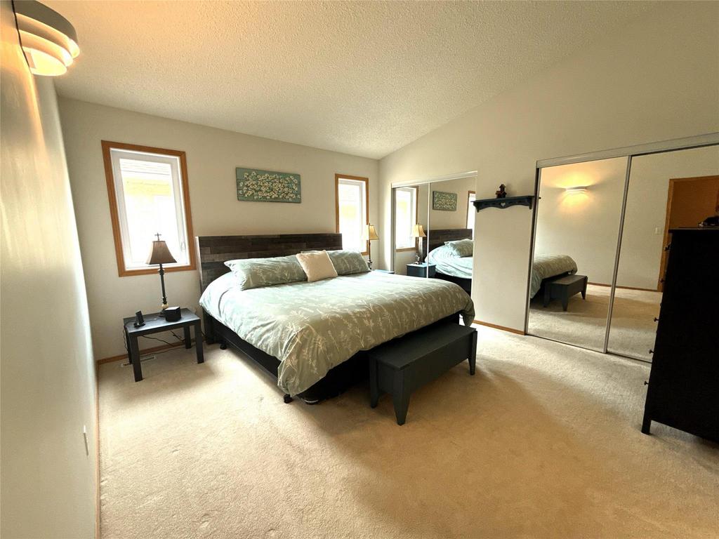40 Forestgate Avenue, Linden Woods · primary bedroom with mirrored closet doors and carpet