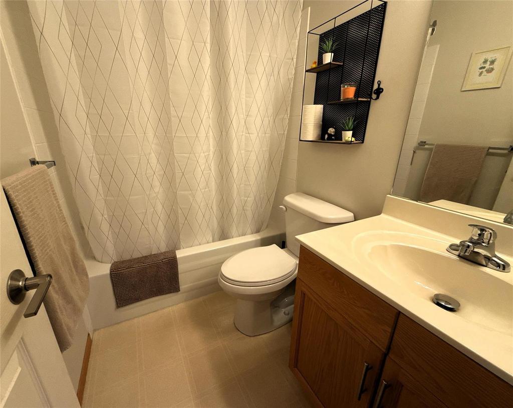 40 Forestgate Avenue, Linden Woods · main bathroom with a tub and shower, vanity and toilet