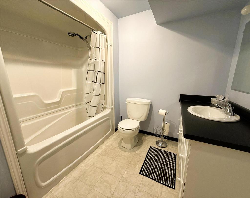 40 Forestgate Avenue, Linden Woods · basement bathroom with a tub and shower and a vanity