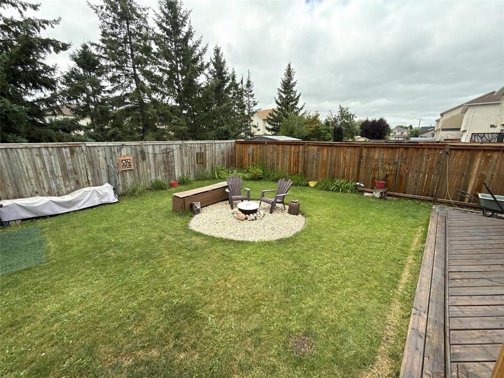 40 Forestgate Avenue, Linden Woods · fenced back yard with the firepit and seating