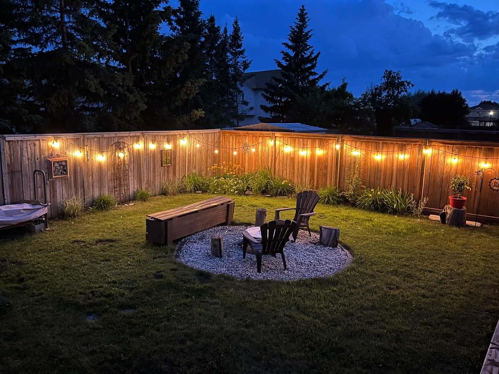 40 Forestgate Avenue, Linden Woods · back yard at dusk with string lights over the firepit