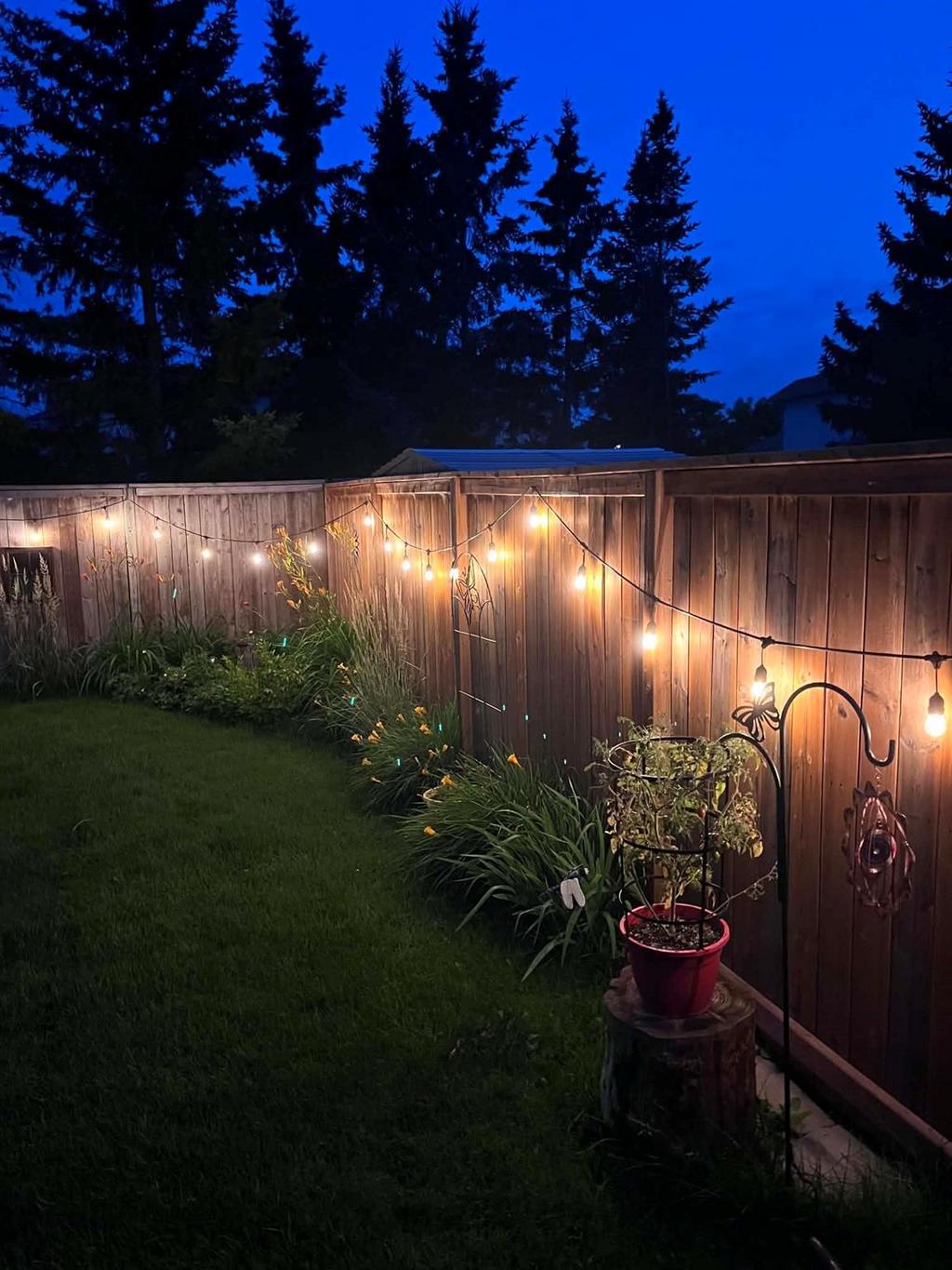 40 Forestgate Avenue, Linden Woods · string lights along the fence line at dusk