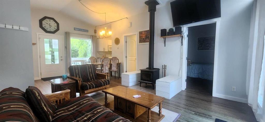 41 Little Deer Road &middot; living room under the vaulted ceiling with the wood stove