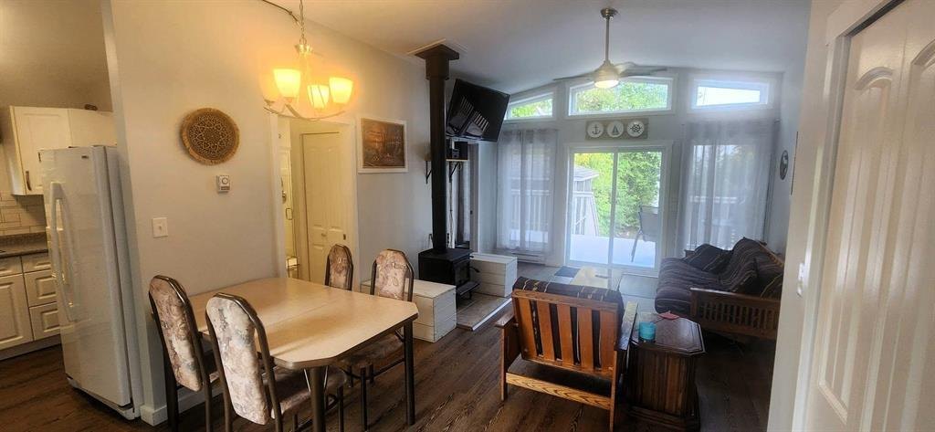 41 Little Deer Road &middot; dining table beside the kitchen and wood stove