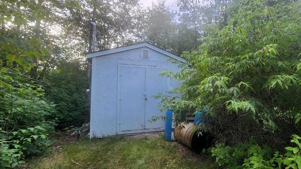 41 Little Deer Road &middot; storage shed at the edge of the trees