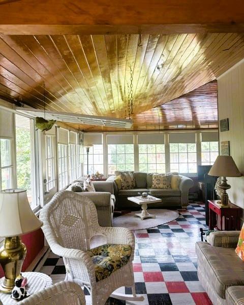 560 Prospect Street, Winnipeg Beach · porch with a wood ceiling and windows the length of the room