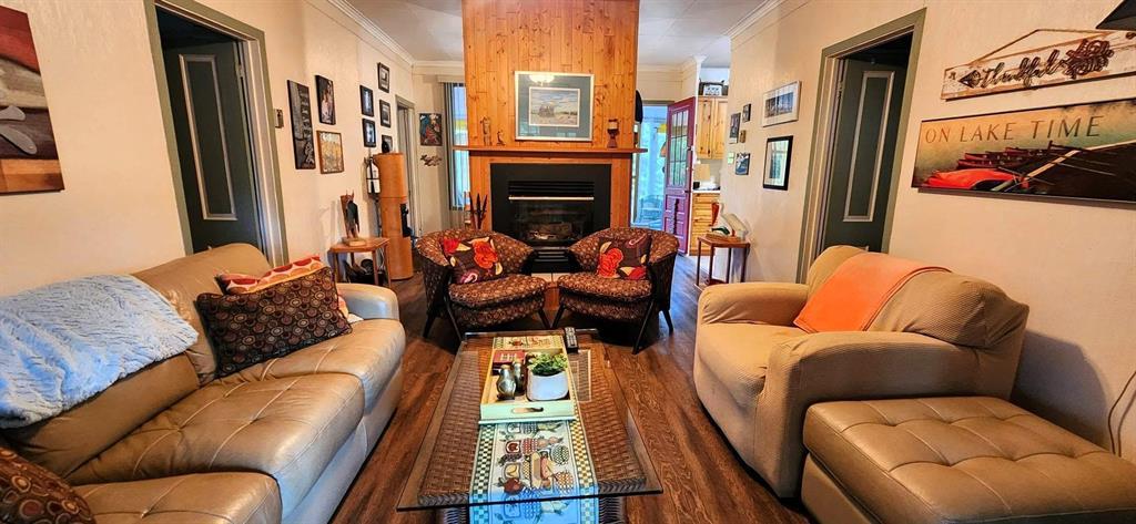 560 Prospect Street, Winnipeg Beach · living room seating grouped around the fireplace