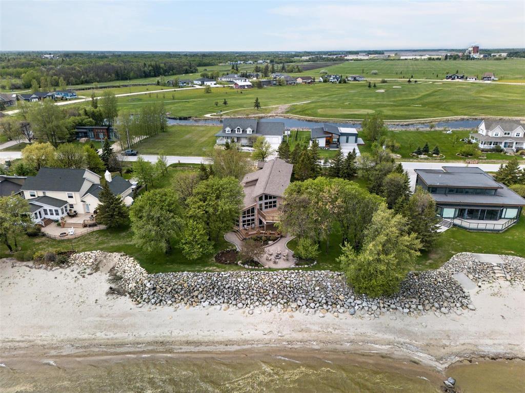 Aerial view of 64 Mercury Drive on the Lake Winnipeg shoreline at Pelican Beach