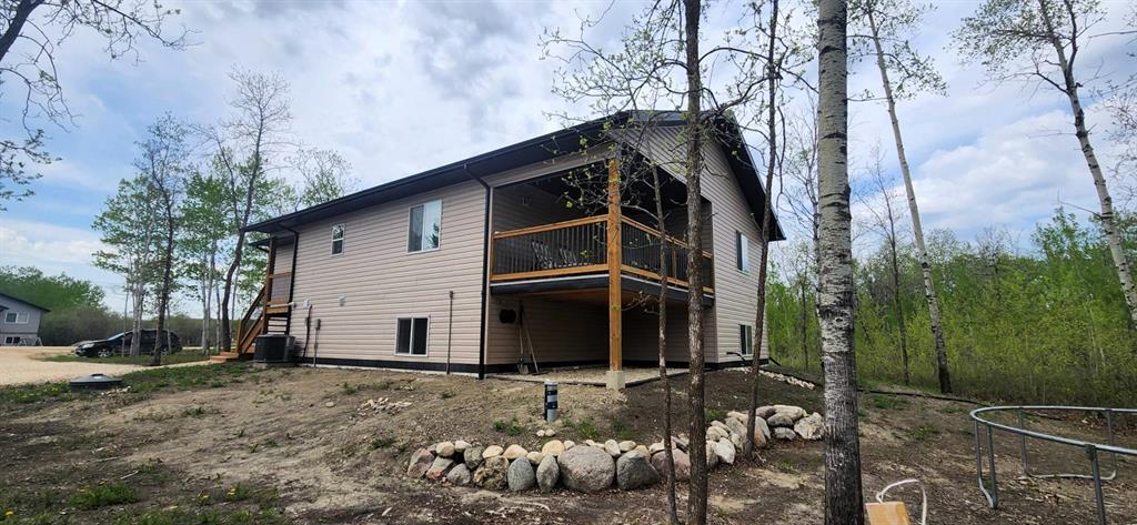 7 Surtsey Road, Sandy Hook · side elevation with the covered deck and treed lot