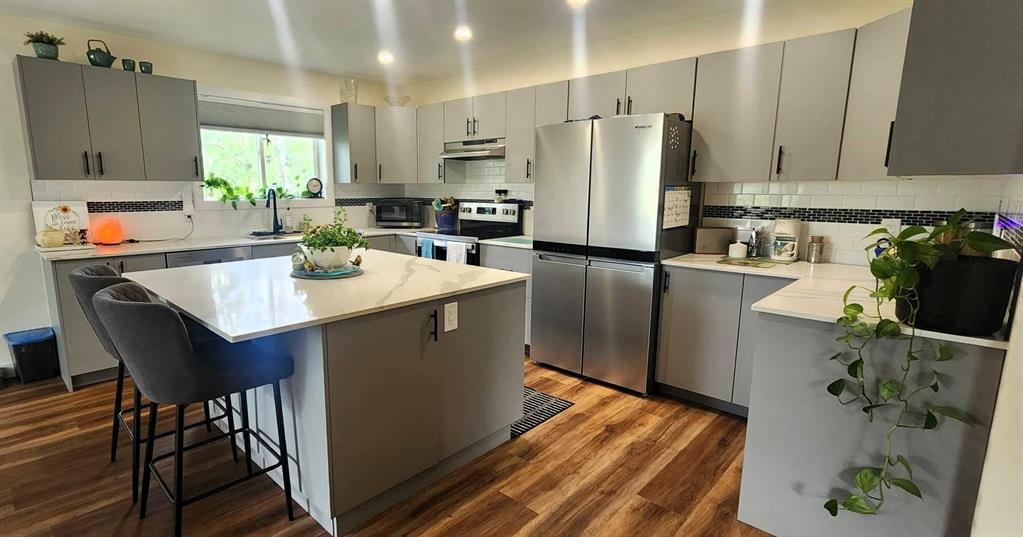 7 Surtsey Road, Sandy Hook · kitchen with island seating and stainless steel appliances