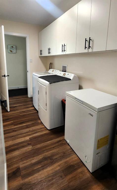 7 Surtsey Road, Sandy Hook · laundry room with washer, dryer, chest freezer and cabinets