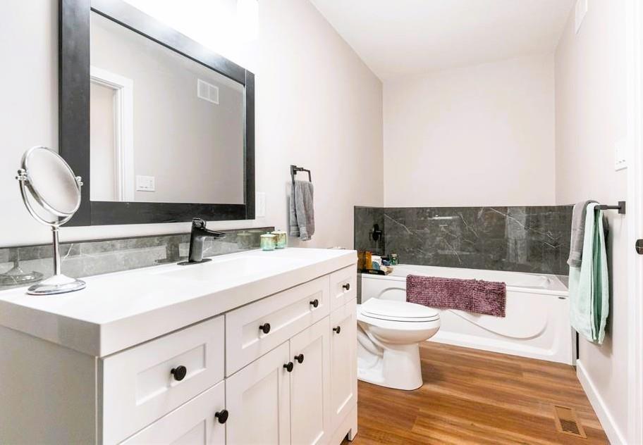 7 Surtsey Road, Sandy Hook · bathroom with long vanity and soaker tub