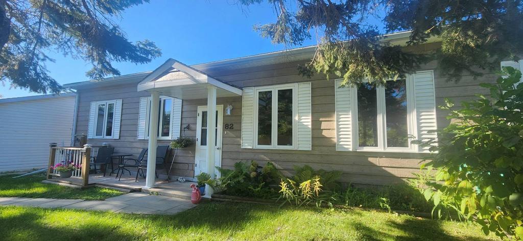 82 Willow Drive, Aspen Park &middot; the front of the bungalow with its covered entry and front patio