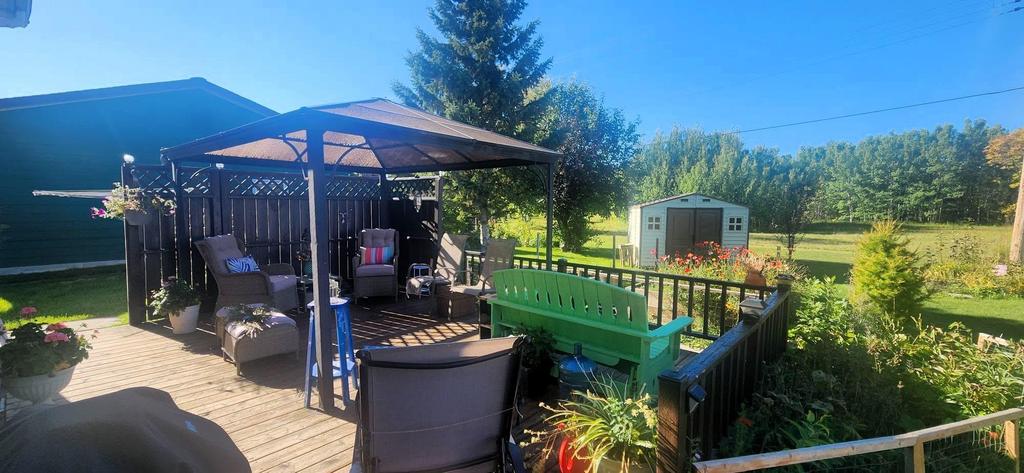 82 Willow Drive, Aspen Park &middot; the large back deck with a covered seating area