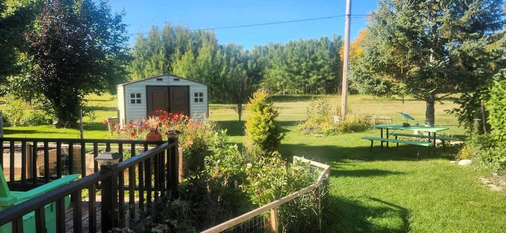 82 Willow Drive, Aspen Park &middot; the view from the deck over the yard and storage shed